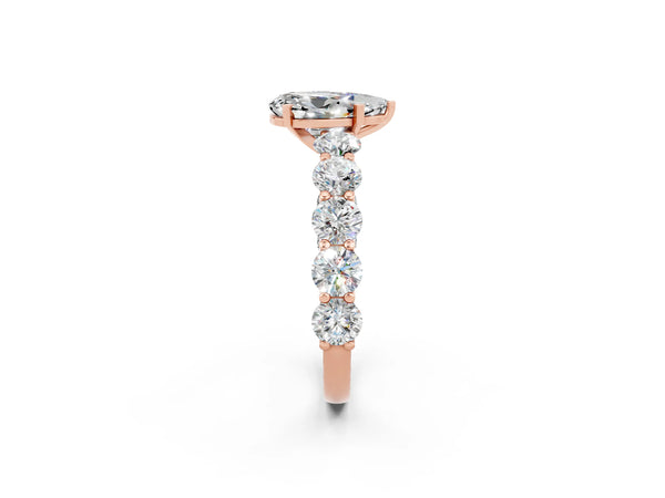 Rose gold Pear Cut Moissanite Prong Setting with Side Stones on a Pave Band