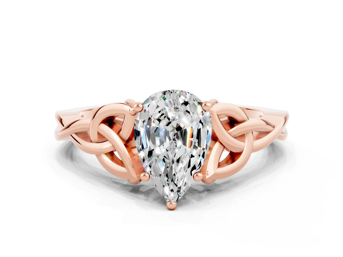 Rose gold Pear Cut Moissanite Solitaire Engagement Ring with Celtic Knot Band and Four-Prong Setting