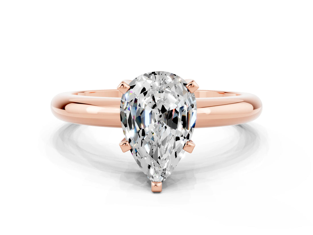 Rose gold Pear Cut Moissanite Solitaire Engagement Ring with Round Band and Four-Prong Setting