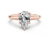 Rose gold Pear Cut Moissanite Solitaire Engagement Ring with Round Band and Four-Prong Setting
