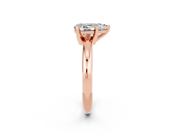 Rose gold Pear Cut Moissanite Solitaire Engagement Ring with Round Band and Four-Prong Setting