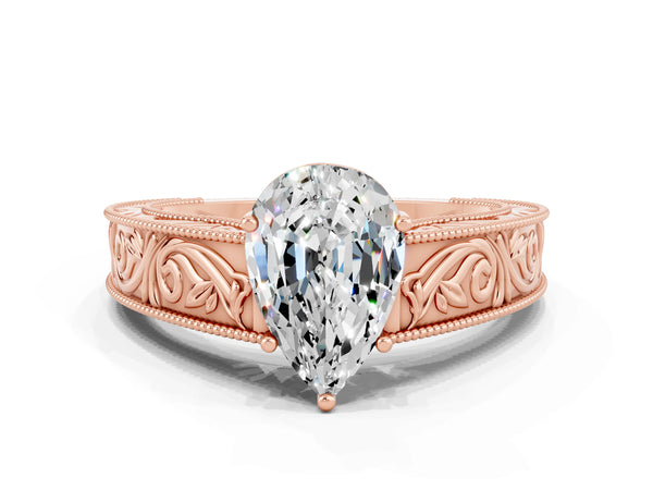 Rose gold Pear Cut Moissanite Solitaire Ring with Engraved Band and Four-Prong Setting