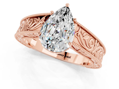 Rose gold Pear Cut Moissanite Solitaire Ring with Engraved Band and Four-Prong Setting_1