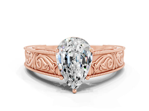 Rose gold Pear Cut Moissanite Solitaire Ring with Engraved Band and Four-Prong Setting