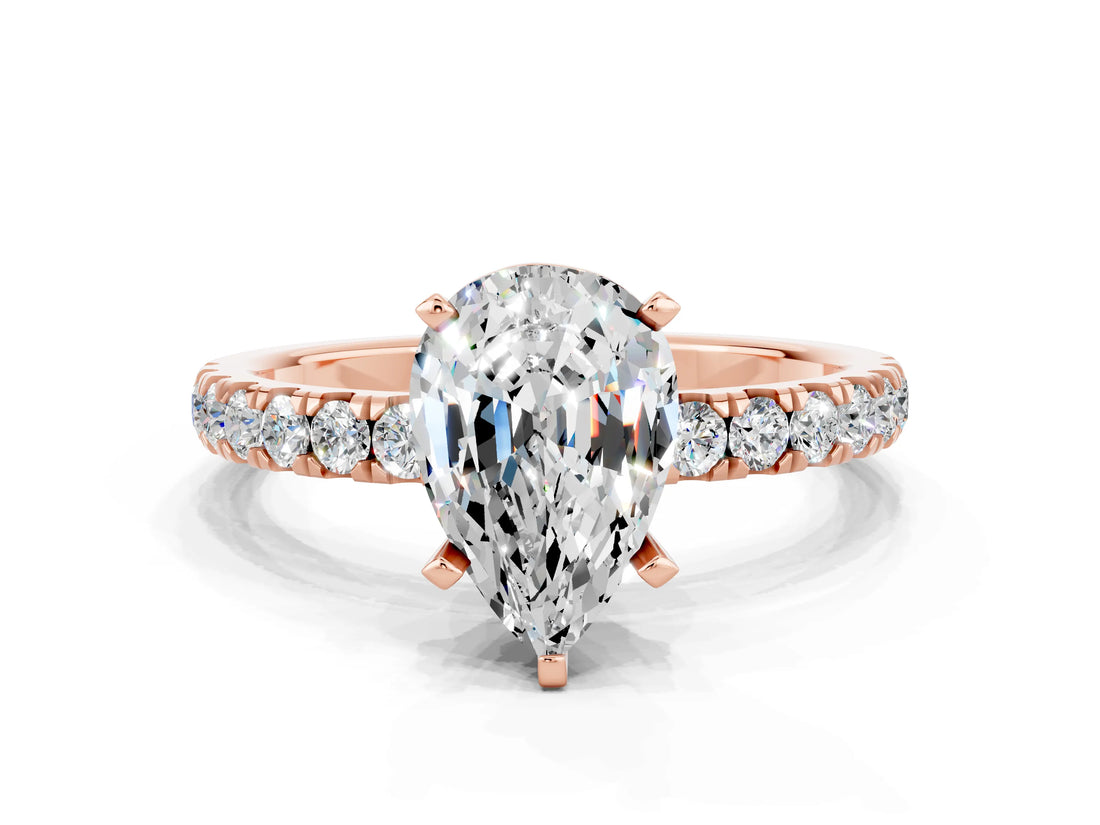 Rose gold Pear Cut Moissanite Solitaire Ring with Pavé Accents and Four-Prong Setting