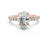 Rose gold Pear Cut Moissanite Solitaire Ring with Pavé Accents and Four-Prong Setting