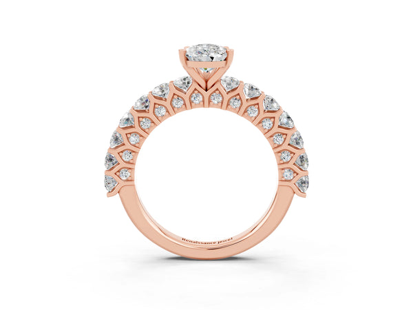 Rose gold Pear Cut Moissanite Solitaire Ring with Shared Prong Pavé Band and Four-Prong Setting