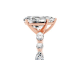 Rose gold Pear Cut Moissanite Solitaire with Side Stones on a Pavé Band and Four-Prong Setting_5