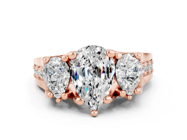 Rose gold Pear Cut Moissanite Three-Stone Ring with Channel Set Band and Four-Prong Setting