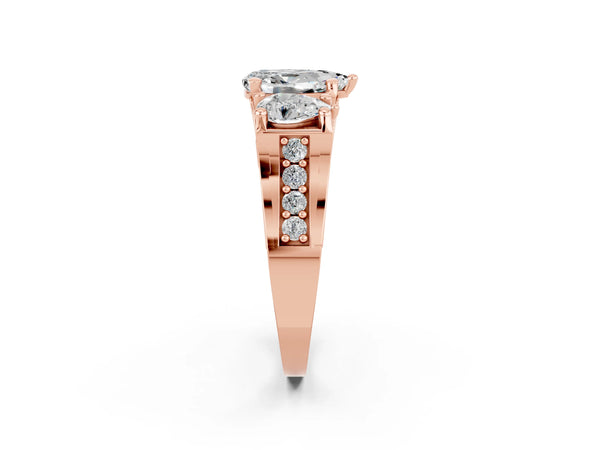Rose gold Pear Cut Moissanite Three-Stone Ring with Channel Set Band and Four-Prong Setting