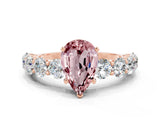 Rose gold Pear Cut Morganite Prong Setting with Side Stones on a Pave Band