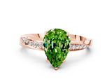 Rose gold Pear Cut Peridot Engagement Ring with Side Stone Accents and Four-Prong Setting_60