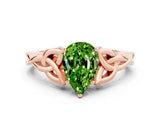 Rose gold Pear Cut Peridot Solitaire Engagement Ring with Celtic Knot Band and Four-Prong Setting