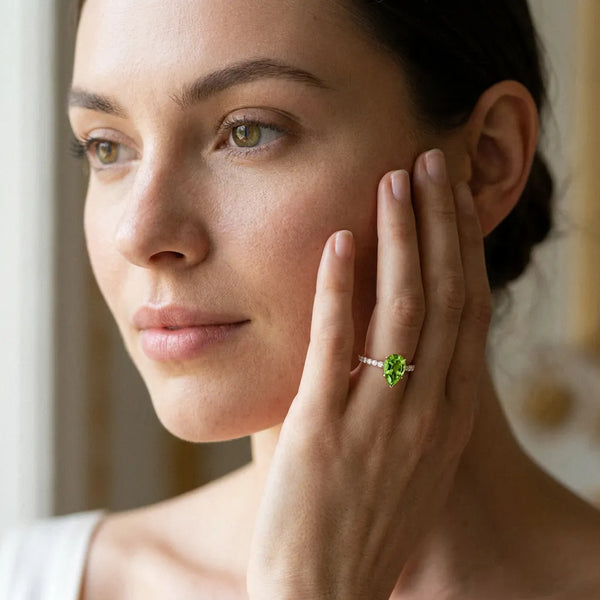 Rose gold Pear Cut Peridot Solitaire Ring with Round  Pavé Band and Four-Prong Setting