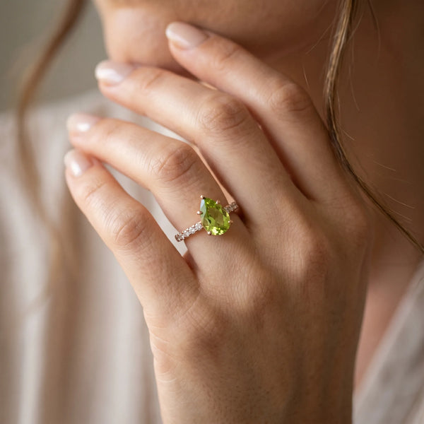 Rose gold Pear Cut Peridot Solitaire Ring with Round  Pavé Band and Four-Prong Setting