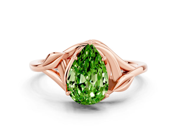Rose gold Pear Cut Peridot Solitaire Ring with Twist Band and Four-Prong Setting