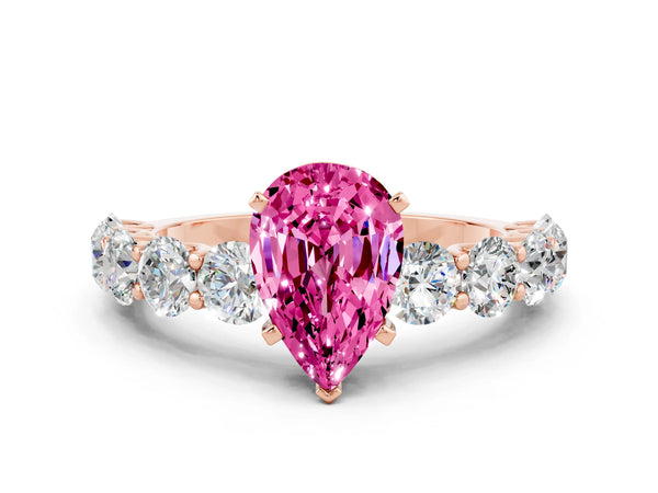 Rose gold Pear Cut Pink Sapphire Prong Setting with Side Stones on a Pave Band