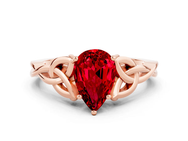 Rose gold Pear Cut Ruby Solitaire Engagement Ring with Celtic Knot Band and Four-Prong Setting
