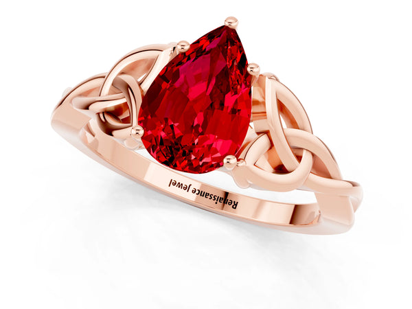 Rose gold Pear Cut Ruby Solitaire Engagement Ring with Celtic Knot Band and Four-Prong Setting