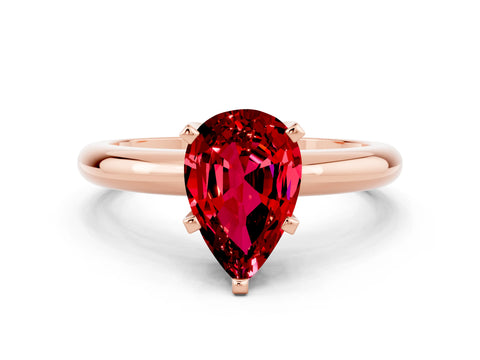 Rose gold Pear Cut Ruby Solitaire Engagement Ring with Round Band and Four-Prong Setting