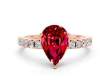 Rose gold Pear Cut Ruby Solitaire Pavé Band with Four-Prong Setting