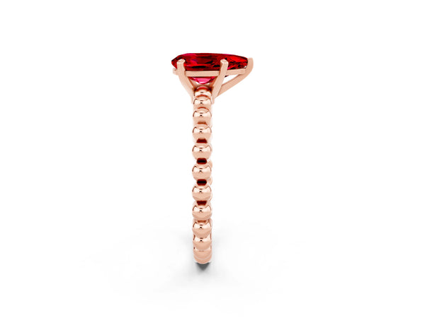 Rose gold Pear Cut Ruby Solitaire Ring with Beaded Band and Prong Setting
