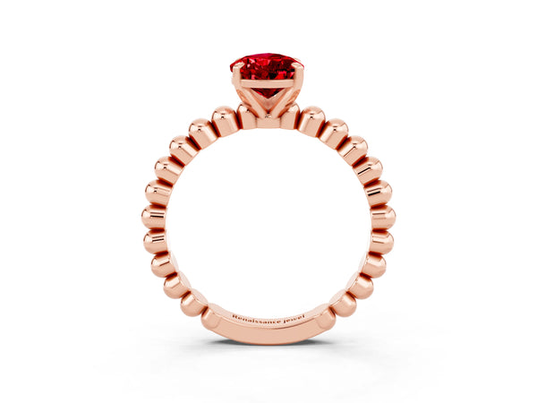 Rose gold Pear Cut Ruby Solitaire Ring with Beaded Band and Prong Setting