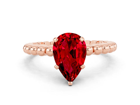 Rose gold Pear Cut Ruby Solitaire Ring with Beaded Band and Prong Setting