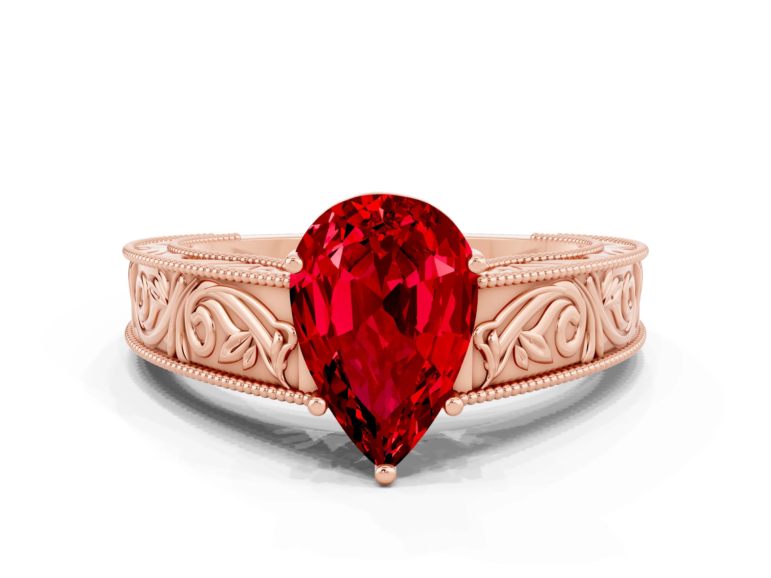 Rose gold Pear Cut Ruby Solitaire Ring with Engraved Band and Four-Prong Setting
