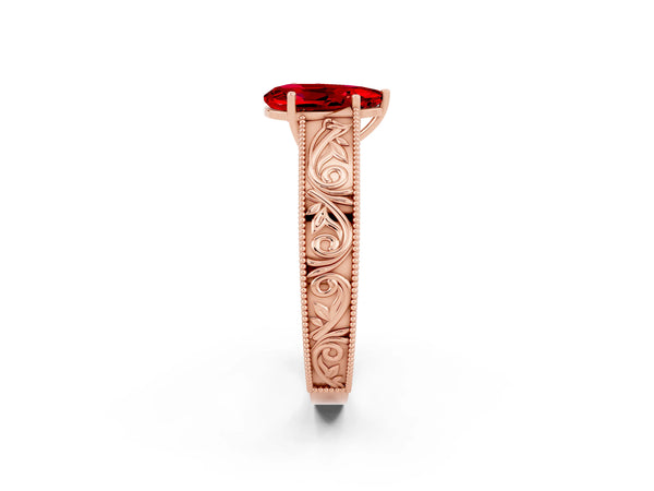 Rose gold Pear Cut Ruby Solitaire Ring with Engraved Band and Four-Prong Setting