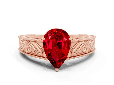 Rose gold Pear Cut Ruby Solitaire Ring with Engraved Band and Four-Prong Setting