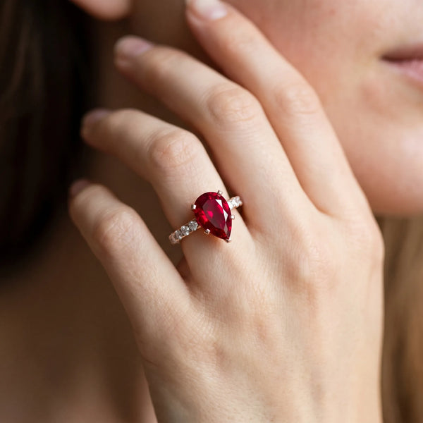 Rose gold Pear Cut Ruby Solitaire Ring with Round  Pavé Band and Four-Prong Setting