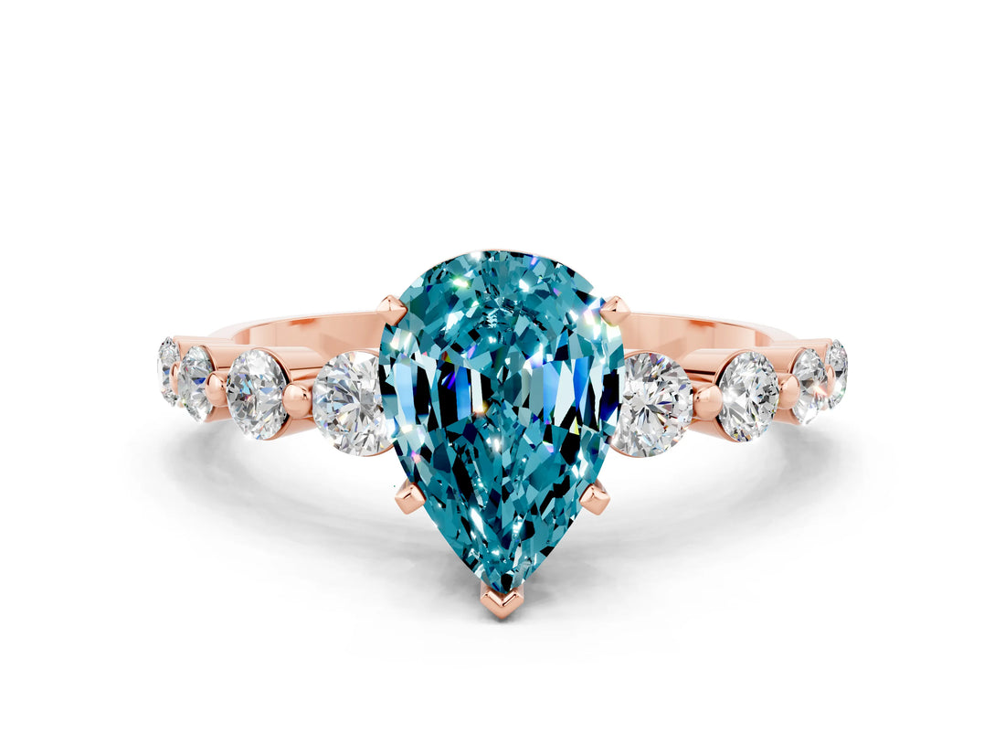 Rose gold Pear Cut Solitaire Blue Topaz Ring with Pave Band and Four-Prong Setting