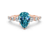 Rose gold Pear Cut Solitaire Blue Topaz Ring with Pave Band and Four-Prong Setting