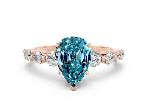 Rose gold Pear Cut Solitaire Blue Topaz Ring with Pave Band and Four-Prong Setting