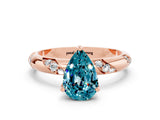 Rose gold Pear Cut Solitaire Diamond Engagement Ring with Twisted Pave Band and Four-Prong Setting