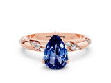 Rose gold Pear Cut Solitaire Diamond Engagement Ring with Twisted Pave Band and Four-Prong Setting