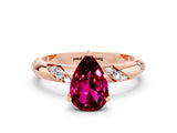 Rose gold Pear Cut Solitaire Diamond Engagement Ring with Twisted Pave Band and Four-Prong Setting