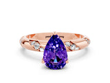 Rose gold Pear Cut Solitaire Diamond Engagement Ring with Twisted Pave Band and Four-Prong Setting