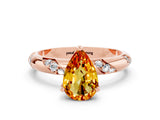 Rose gold Pear Cut Solitaire Diamond Engagement Ring with Twisted Pave Band and Four-Prong Setting