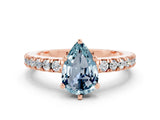 Rose gold Pear Cut Solitaire Diamond with Pavé Band and Four-Prong Setting