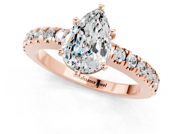 Rose gold Pear Cut Solitaire Moissanite with Pavé Band and Four-Prong Setting