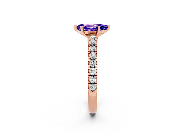 Rose gold Pear Cut Solitaire Tanzanite with Pavé Band and Four-Prong Setting