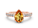 Rose gold Pear Cut Solitaire Diamond with Pavé Band and Four-Prong Setting