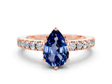 Rose gold Pear Cut Solitaire Diamond with Pavé Band and Four-Prong Setting