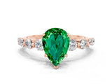 Rose gold Pear Cut Solitaire Emerald Ring with Pave Band and Four-Prong Setting