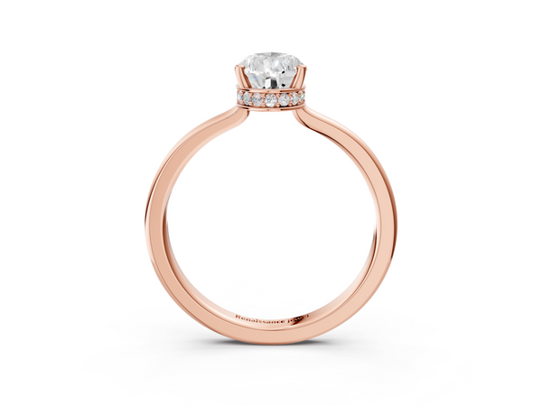 Rose gold Pear Cut Solitaire Engagement Ring with Four-Prong Setting on a Classic Band
