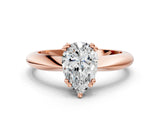 Rose gold Pear Cut Solitaire Engagement Ring with Tapered Band and Four-Prong Setting