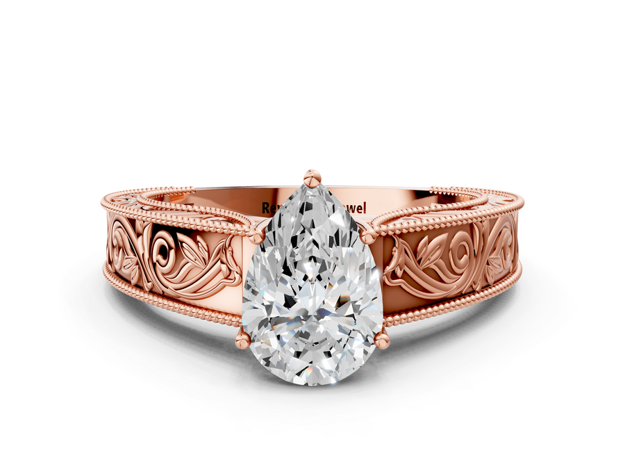 Rose gold Pear Cut Diamond Solitaire Ring with Engraved Band and Four-Prong Setting