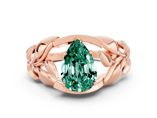 Rose gold Pear Cut Green Sapphire Leaf-Inspired Engagement Ring with Round Accents and Prong Setting